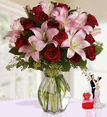 5 Stems of Pink Lilies & 12 Stem of Red Roses with fillers in a Glass Vase Shine Of Love