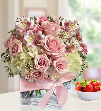 10 Pink Roses ,4 Pink and 3 white carnation with 2 stems of pink alstromeria in a cube Glass vase (one sided round arrangement) Charming Beauty