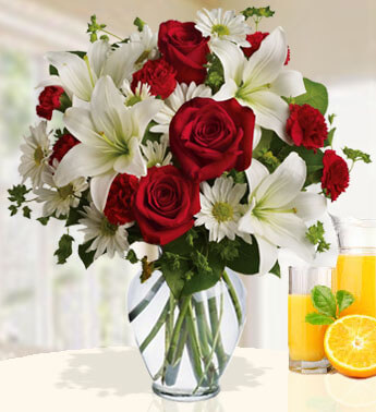 6 Red Carnation, 6 stems of White Chrysanthemum, 4 stems of White Lily, 8 Red Rose in a Glass Vase (one sided round arrangement) Rich Romance