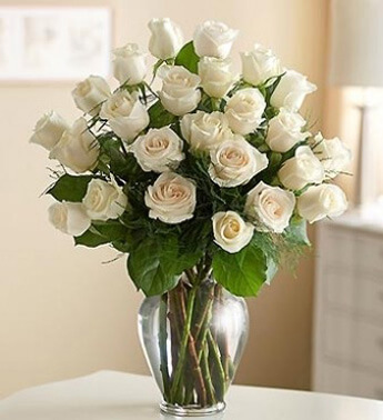 24 White Roses with fillers in a glass vase. Joyful Bouquet