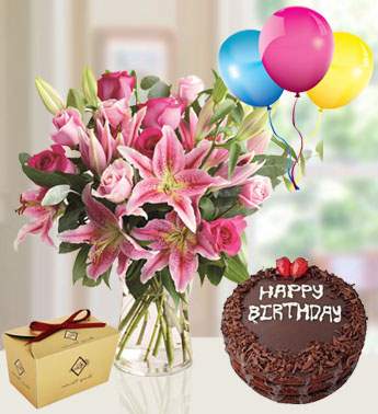 5 stems of Pink Lilies , 12 Pink Rose in a glass vase with 250 gms Of Choco Chocolate , 1 Kg Chocolate Cake and 3 Latex Balloon Passionate Pink Combo